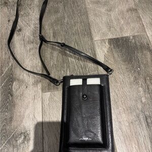 Compact Black Crossbody Bag with Leather Material and Adjustable Strap
